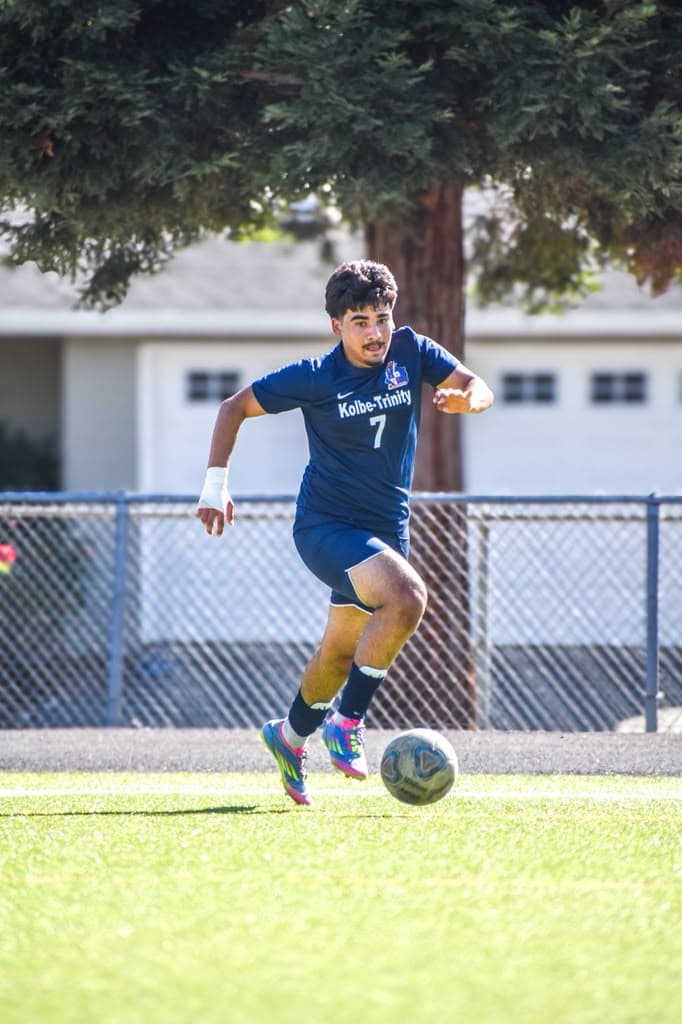 A Crusader carries the ball into the attacking half.