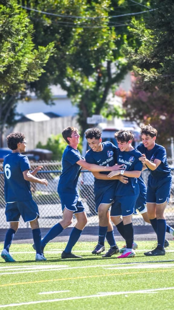 The Crusaders celebrate together after a goal.