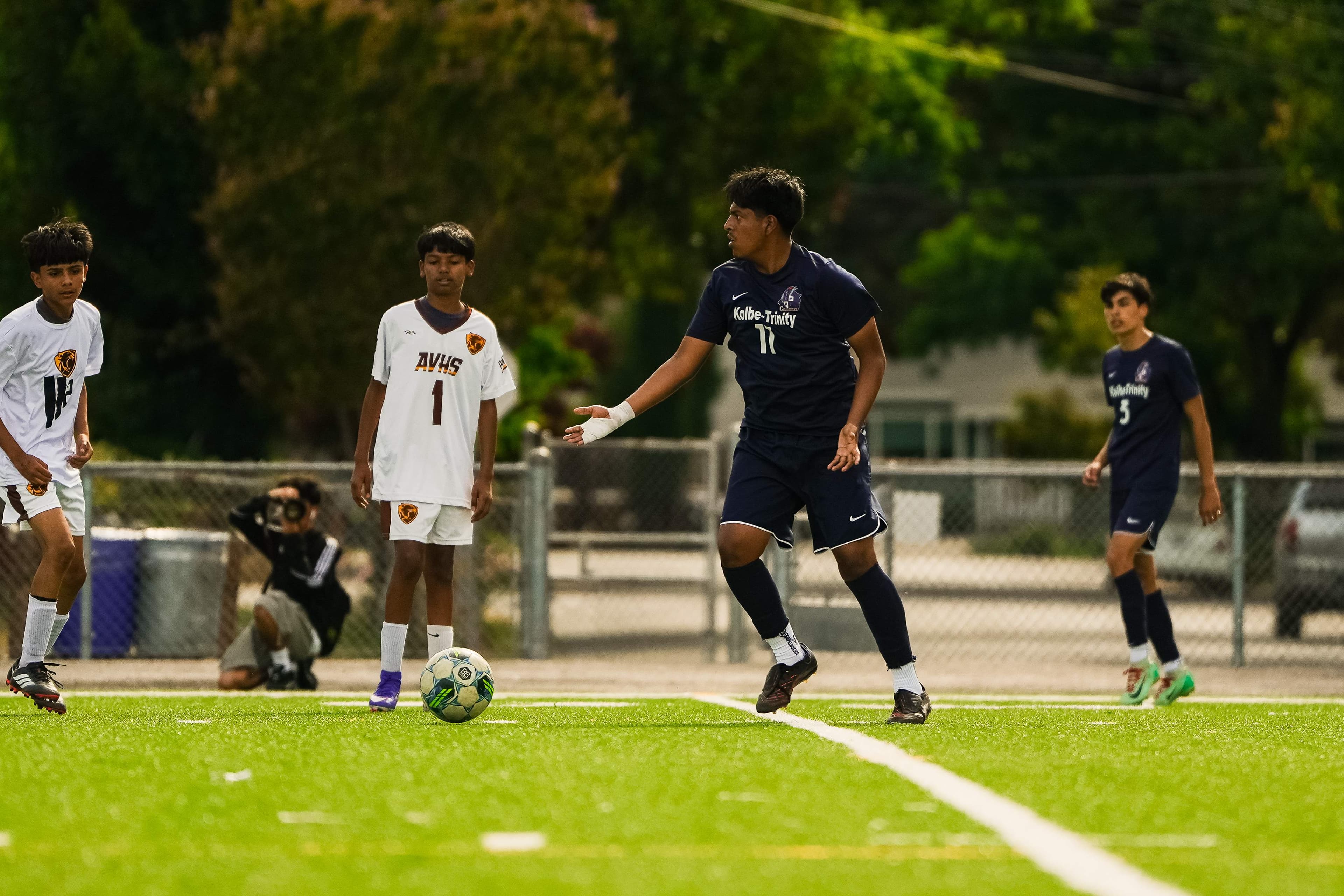 Settling the ball with a Crusader teammate close behind.