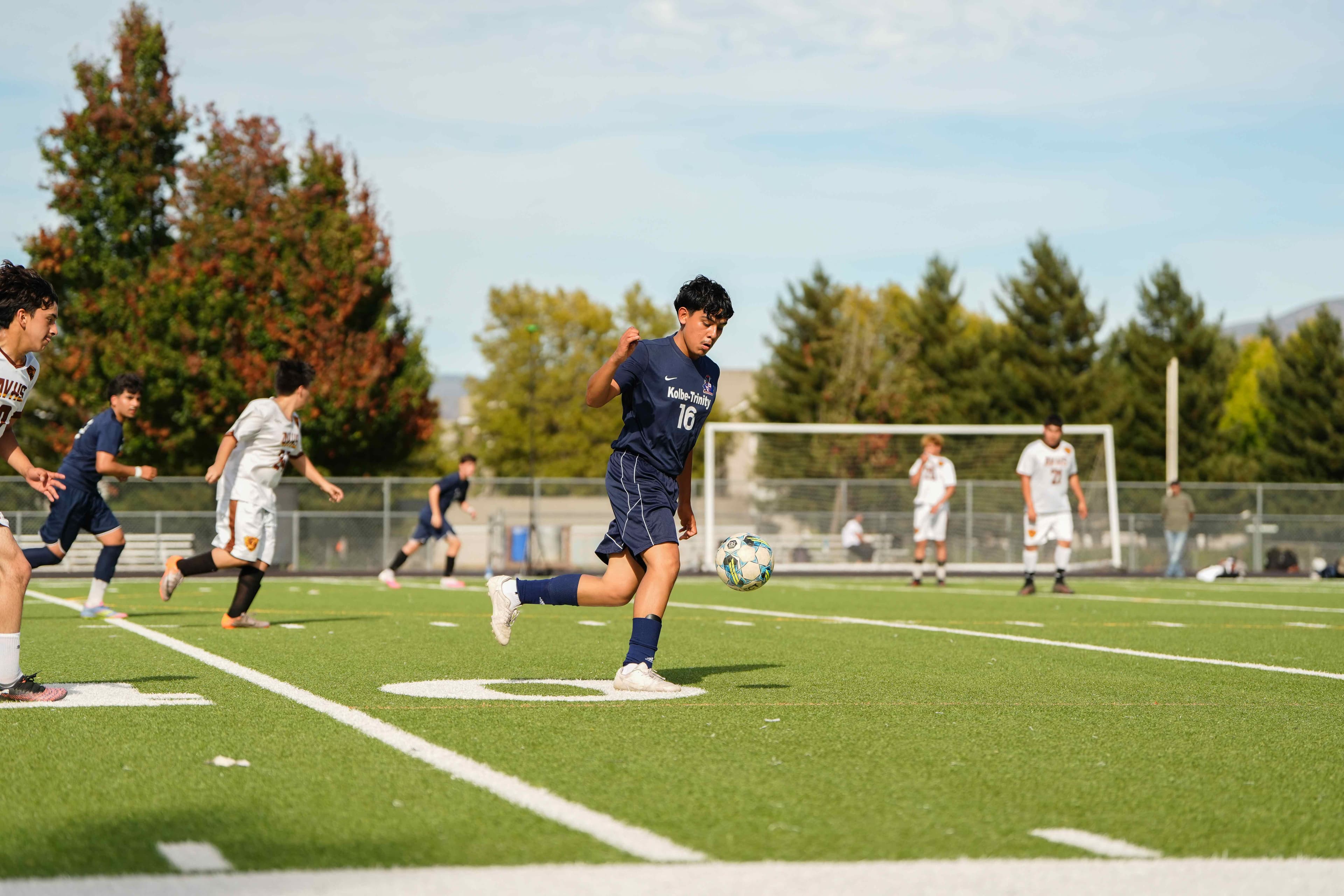 Chasing the ball down against a non-league opponent.