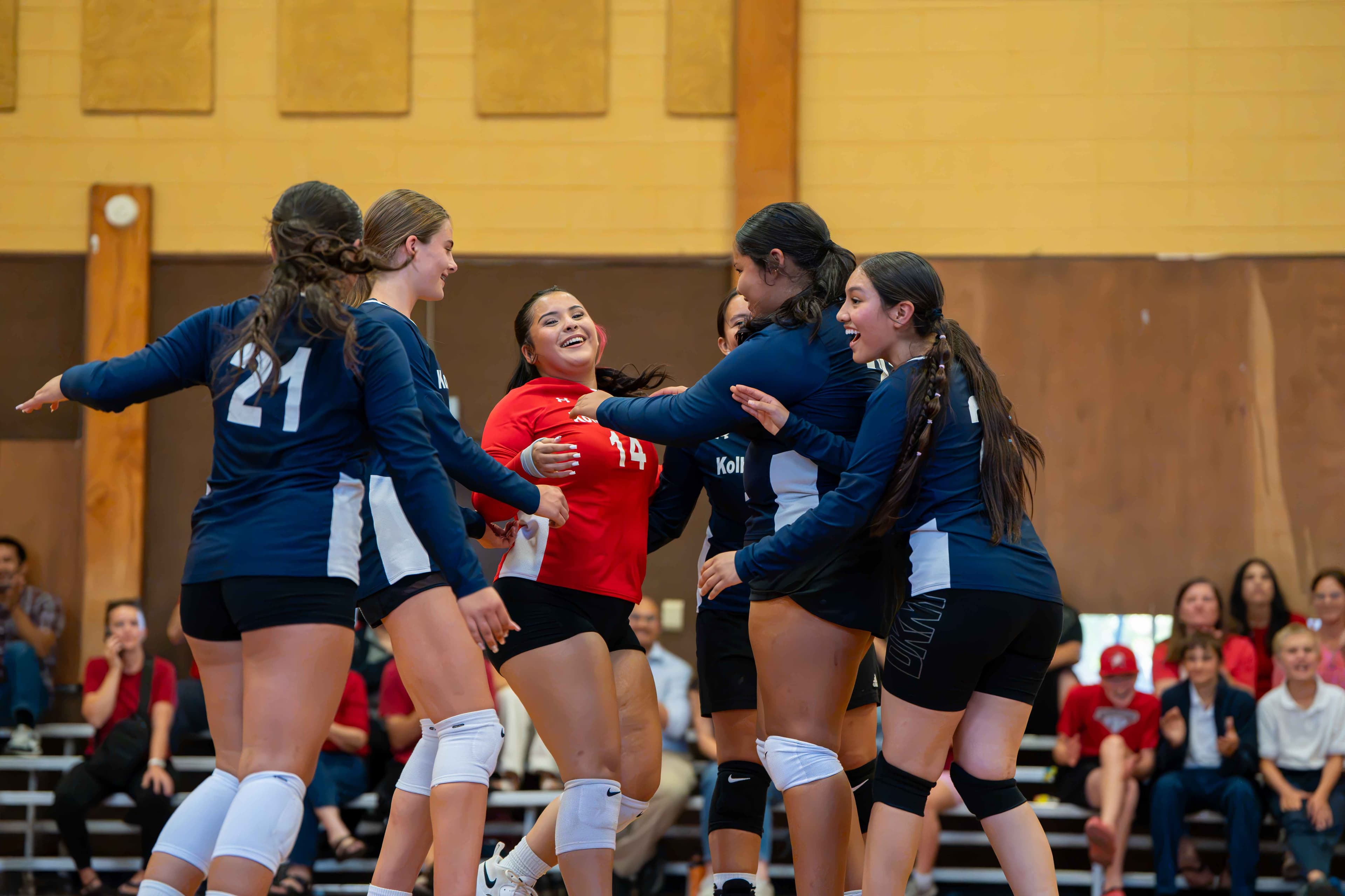 The Crusaders celebrate together after a point.