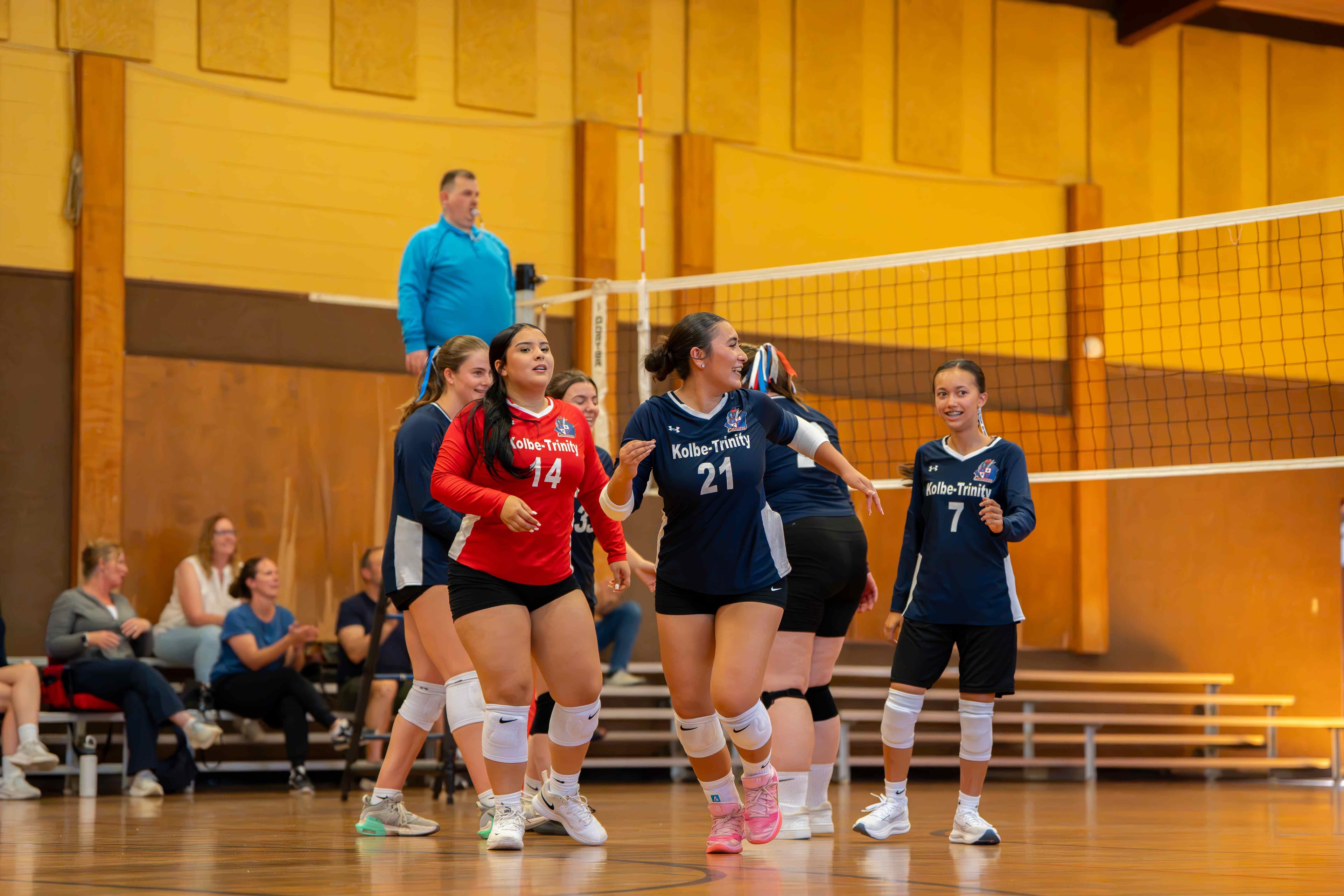 Going up for a swing at the net against the Mustangs.